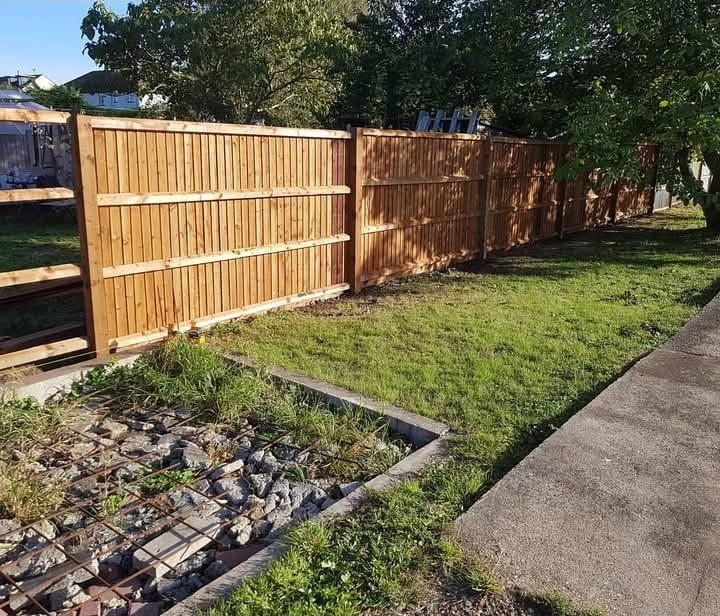 Long run of new timber garden fencing along a rear boundary